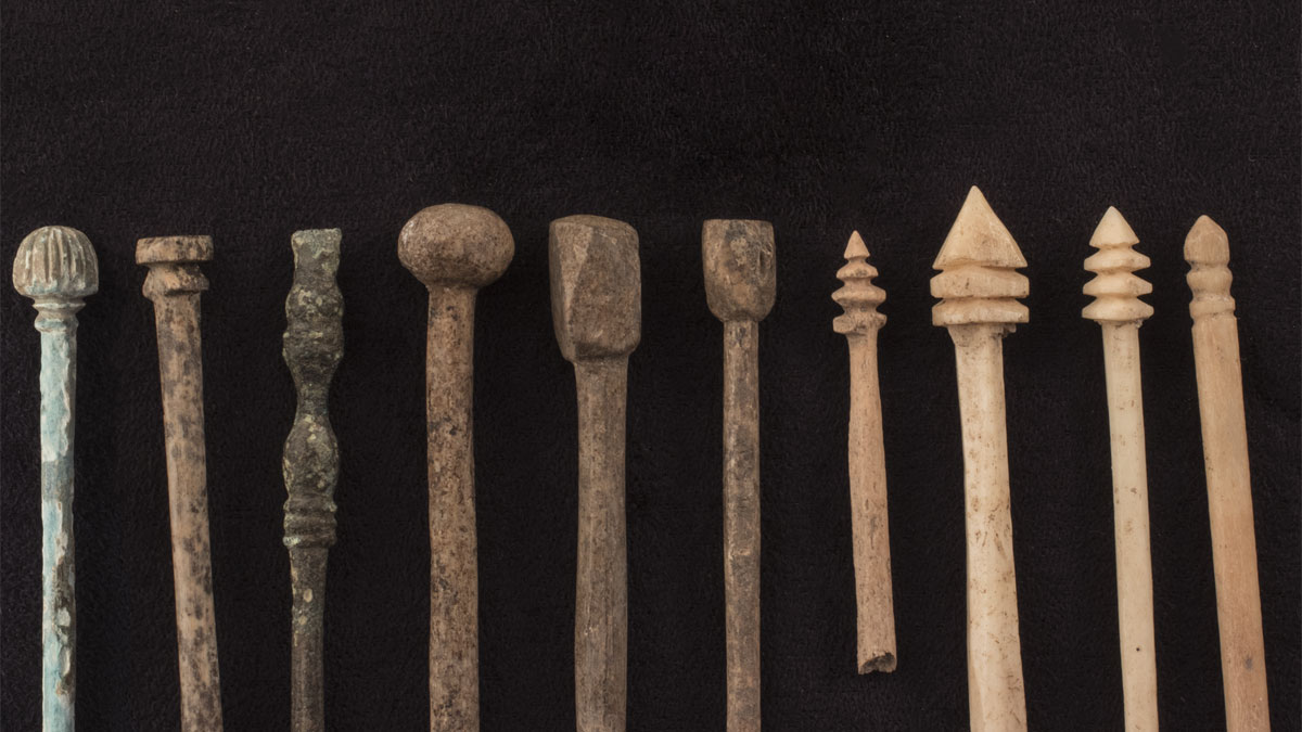 Ancient wooden pin tops