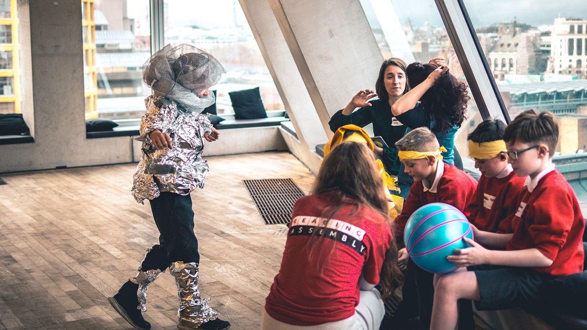 children interacting with Reading Assembly arts students at the Tate Exchange