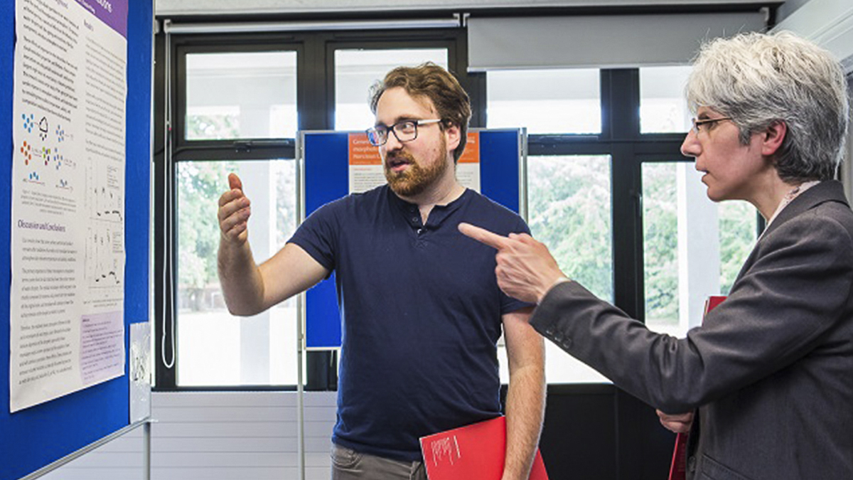 PhD graduate Ben Woden explaining his research