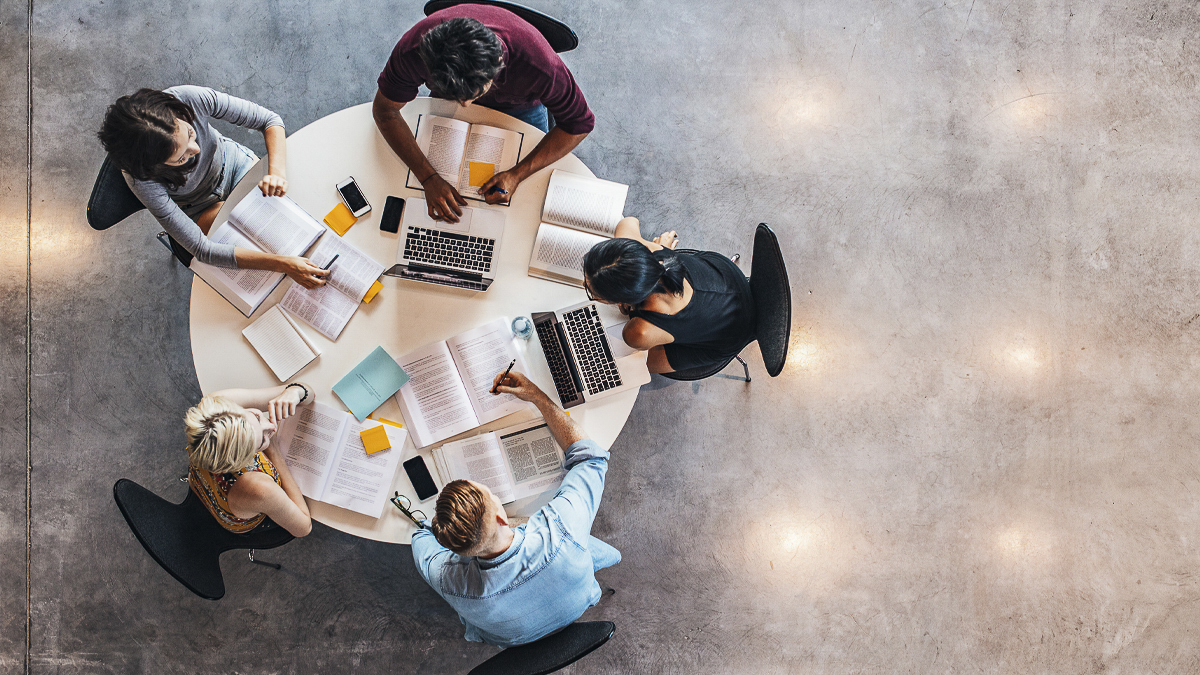 Aerial view of five students at a table