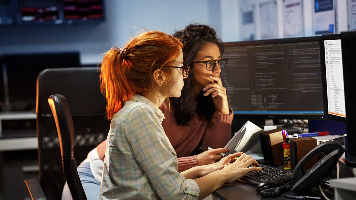 Two students working on a computer
