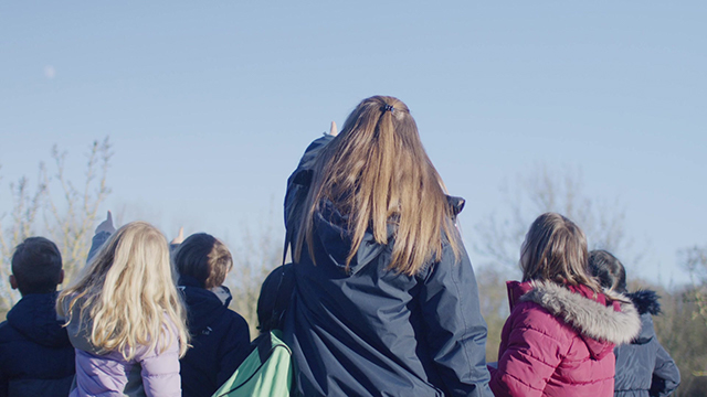 Teacher and pupils outside