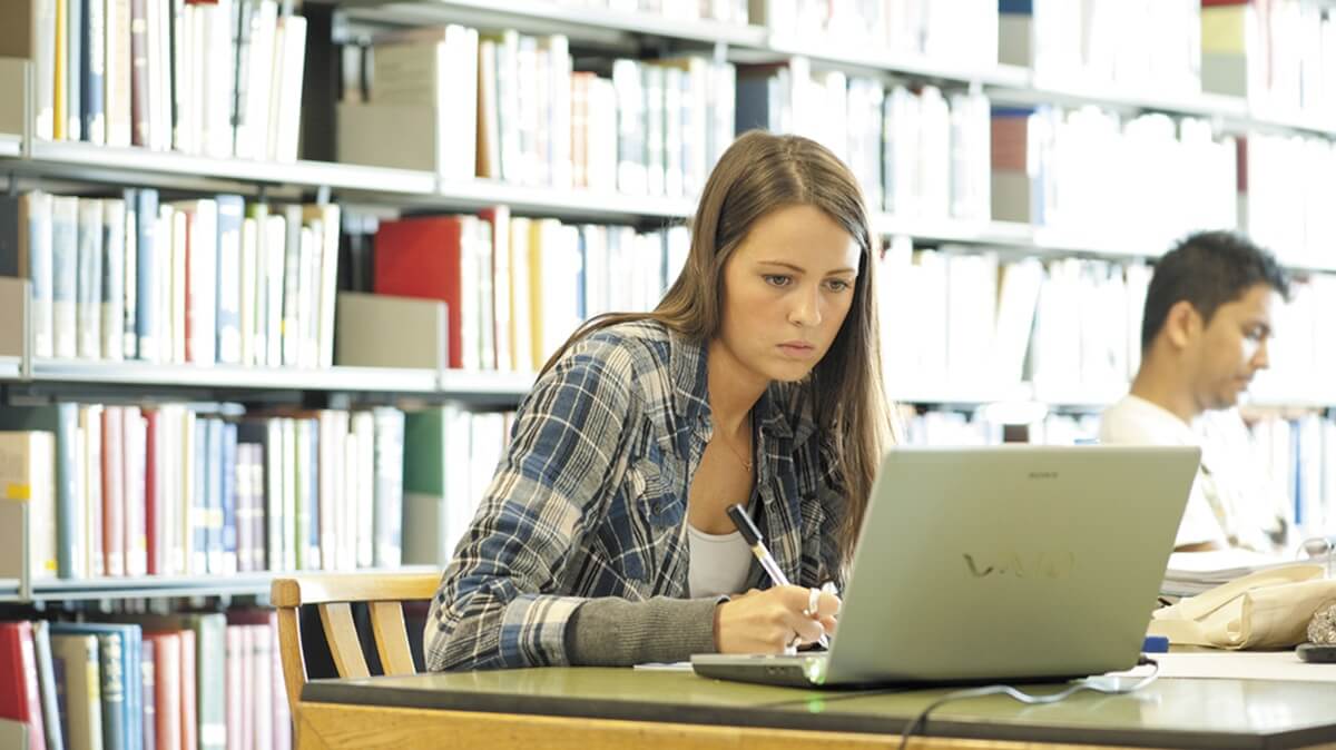 A woman working at her laptop