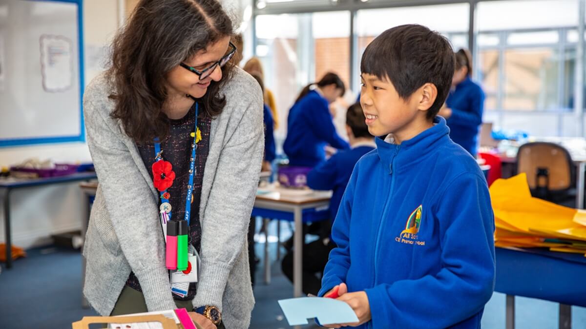 A teacher helping a pupil
