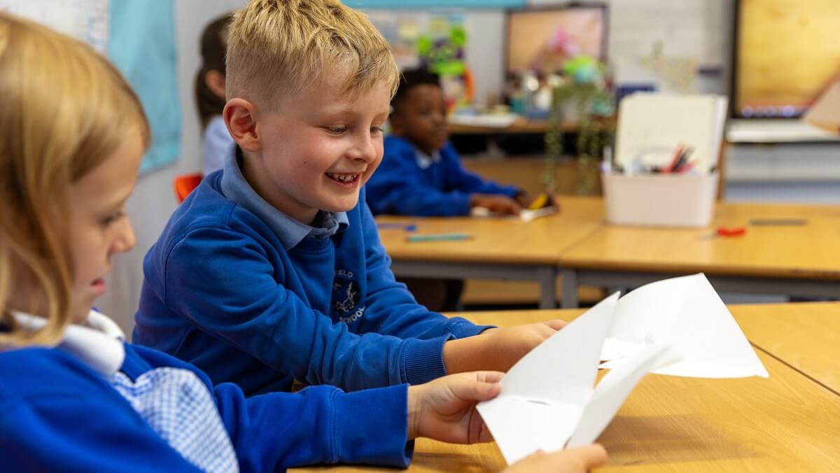 Two schoolchildren at a desk
